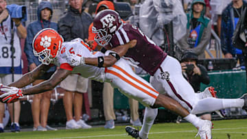 COLLEGE STATION, TX - SEPTEMBER 08: Tee Higgins #5 of the Clemson Tigers dives for the endzone as Otaro Alaka #42 of the Texas A&M Aggies is unable to prevent the touchdown at Kyle Field on September 8, 2018 in College Station, Texas. (Photo by Bob Levey/Getty Images)