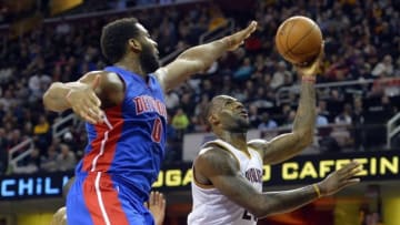 Feb 22, 2016; Cleveland, OH, USA; Detroit Pistons center Andre Drummond (0) defends a shot by Cleveland Cavaliers forward LeBron James (23) in the fourth quarter at Quicken Loans Arena. Mandatory Credit: David Richard-USA TODAY Sports