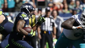 Sep 11, 2016; Seattle, WA, USA; Seattle Seahawks running back Thomas Rawls (34) rushes against the Miami Dolphins during the third quarter at CenturyLink Field. Seattle defeated Miami, 12-10. Mandatory Credit: Joe Nicholson-USA TODAY Sports