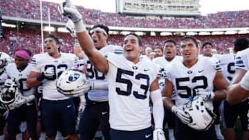 MADISON, WI - SEPTEMBER 15: Isaiah Kaufusi #53 of the BYU Cougars celebrates with teammates after the game against the Wisconsin Badgers at Camp Randall Stadium on September 15, 2018 in Madison, Wisconsin. BYU won 24-21. (Photo by Joe Robbins/Getty Images)