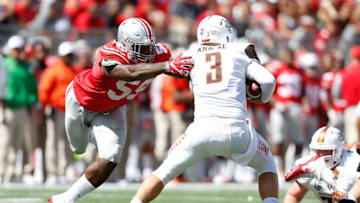COLUMBUS, OH - SEPTEMBER 3: James Knapke #3 of the Bowling Green Falcons dodges a tackle by Tyquan Lewis #59 of the Ohio State Buckeyes during the third quarter on September 3, 2016 at Ohio Stadium in Columbus, Ohio. Ohio State defeated Bowling Green 77-10. (Photo by Kirk Irwin/Getty Images)