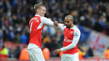 LONDON, ENGLAND - FEBRUARY 14: Per Mertesacker and Theo Walcott of Arsenal celebrates after the Barclays Premier League match between Arsenal and Leicester City at Emirates Stadium on February 14th, 2016 in London, England (Photo by David Price/Arsenal FC via Getty Images)