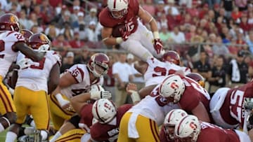 Sep 17, 2016; Stanford, CA, USA; Stanford Cardinal running back Christian McCaffrey (5) carries the ball against the USC Trojans during a NCAA football game at Stanford Stadium. Mandatory Credit: Kirby Lee-USA TODAY Sports