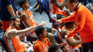 Jan 19, 2021; Champaign, Illinois, USA; Illinois Fighting Illini head coach Brad Underwood (R) fist bumps Illinois Fighting Illini guard Trent Frazier (1) and forward Giorgi Bezhanishvili (15) during the second half against the Penn State Nittany Lions at the State Farm Center. Mandatory Credit: Patrick Gorski-USA TODAY Sports