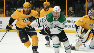 NASHVILLE, TN - OCTOBER 12: Dallas Stars right wing Brett Ritchie (25) and Nashville Predators defenseman Matt Irwin (52) pursue the loose puck during the NHL game between the Dallas Stars and the Nashville Predators, held on October 12, 2017, at Bridgestone Arena in Nashville, Tennessee. (Photo by Danny Murphy/Icon Sportswire via Getty Images)