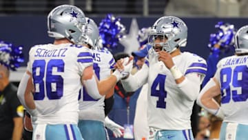 ARLINGTON, TEXAS - SEPTEMBER 27: Dalton Schultz #86 of the Dallas Cowboys celebrates his first half touchdown with Dak Prescott #4 while playing the Philadelphia Eagles at AT&T Stadium on September 27, 2021 in Arlington, Texas. (Photo by Richard Rodriguez/Getty Images)