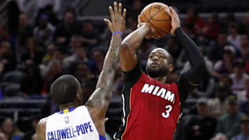 Apr 12, 2016; Auburn Hills, MI, USA; Miami Heat guard Dwyane Wade (3) takes a shot over Detroit Pistons guard Kentavious Caldwell-Pope (5) during the first quarter at The Palace of Auburn Hills. Mandatory Credit: Raj Mehta-USA TODAY Sports