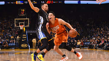 OAKLAND, CA - DECEMBER 3: Devin Booker #1 of the Phoenix Suns handles the ball during the game against the Golden State Warriors on December 3, 2016 at ORACLE Arena in Oakland, California. NOTE TO USER: User expressly acknowledges and agrees that, by downloading and or using this photograph, user is consenting to the terms and conditions of Getty Images License Agreement. Mandatory Copyright Notice: Copyright 2016 NBAE (Photo by Noah Graham/NBAE via Getty Images)