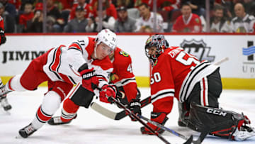 CHICAGO, IL - NOVEMBER 08: Andrei Svechnikov #37 of the Carolina Hurricanes pushes the puck past Corey Crawford #50 of the Chicago Blackhawks to score a first period goal at the United Center on November 8, 2018 in Chicago, Illinois. (Photo by Jonathan Daniel/Getty Images)