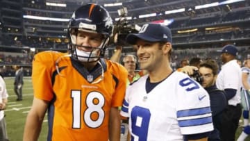 Aug 28, 2014; Arlington, TX, USA; Denver Broncos quarterback Peyton Manning (18) meets with Dallas Cowboys quarterback Tony Romo (9) at AT&T Stadium. The Broncos beat the Cowboys 27-3. Mandatory Credit: Matthew Emmons-USA TODAY Sports