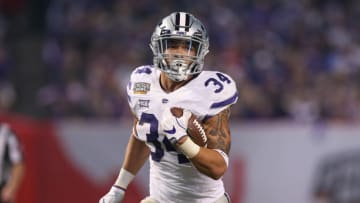 PHOENIX, AZ - DECEMBER 26: Alex Barnes (34) of the Kansas State Wildcatsruns for a gain during the Cactus Bowl game between the Kansas State Wildcats and the UCLA Bruins on December 26, 2017 at Chase Field in Phoenix, AZ. (Photo by Jordon Kelly/Icon Sportswire via Getty Images)