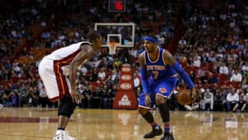 Nov 23, 2015; Miami, FL, USA; New York Knicks forward Carmelo Anthony (7) dibbles the ball against the Miami Heat forward Chris Bosh (1) during the first half at American Airlines Arena. Mandatory Credit: Steve Mitchell-USA TODAY Sports
