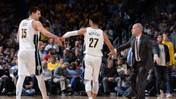 DENVER, CO - APRIL 3: Michael Malone, Nikola Jokic #15 , and Jamal Murray #27 of the Denver Nuggets high five during the game against the Indiana Pacers on April 3, 2018 at the Pepsi Center in Denver, Colorado. NOTE TO USER: User expressly acknowledges and agrees that, by downloading and/or using this Photograph, user is consenting to the terms and conditions of the Getty Images License Agreement. Mandatory Copyright Notice: Copyright 2018 NBAE (Photo by Bart Young/NBAE via Getty Images)