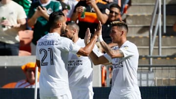 HOUSTON, TEXAS - FEBRUARY 29: Cristian Pavon #10 of Los Angeles Galaxy is congratulated by Giancarlo Gonzalez #21 and Sebastian Lletget #17 after scoring against the Houston Dynamo during the first half at BBVA Stadium on February 29, 2020 in Houston, Texas. (Photo by Bob Levey/Getty Images)