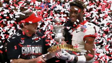 NEW ORLEANS, LOUISIANA - JANUARY 01: George Pickens #1 of the Georgia Bulldogs and head coach Kirby Smart of the Georgia Bulldogs hold the Allstate Sugar Bowl trophy after defeating the Baylor Bears 26-14 at Mercedes Benz Superdome on January 01, 2020 in New Orleans, Louisiana. (Photo by Sean Gardner/Getty Images)