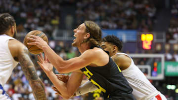 HONOLULU, HAWAII - OCTOBER 8: Kelly Olynyk #41 of the Utah Jazz reacts as he is fouled by Kenyon Martin #6 of the Los Angeles Clippers during the second half of the preseason game at SimpliFi Arena at the Stan Sheriff Center on October 8, 2023 in Honolulu, Hawaii. NOTE TO USER: User expressly acknowledges and agrees that, by downloading and or using this photograph, User is consenting to the terms and conditions of the Getty Images License Agreement. (Photo by Darryl Oumi/Getty Images)