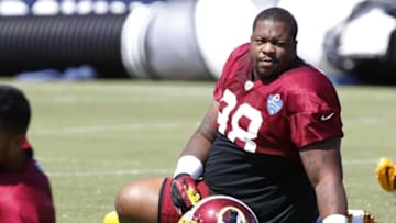 Aug 1, 2015; Richmond, VA, USA; Washington Redskins defensive tackle Terrance Knighton (98) stretches on the field during afternoon practice as part of day three of training camp at Bon Secours Washington Redskins Training Center. Mandatory Credit: Geoff Burke-USA TODAY Sports