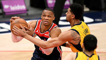 WASHINGTON, DC - MARCH 29: Russell Westbrook #4 of the Washington Wizards drives to the hoop in front of Jeremy Lamb #26 of the Indiana Pacers during the first half at Capital One Arena on March 29, 2021 in Washington, DC. NOTE TO USER: User expressly acknowledges and agrees that, by downloading and or using this photograph, User is consenting to the terms and conditions of the Getty Images License Agreement. (Photo by Will Newton/Getty Images)