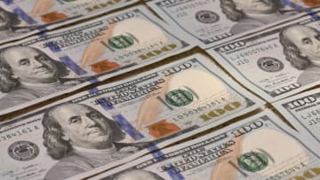 UKRAINE - 2021/08/04: In this photo illustration, American100 dollar bills seen on display. (Photo Illustration by Mykola Tys/SOPA Images/LightRocket via Getty Images)