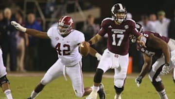 Nov 16, 2013; Starkville, MS, USA; Mississippi State Bulldogs quarterback Tyler Russell (17) runs the ball through the line during the game against the Alabama Crimson Tide at Davis Wade Stadium. Mandatory Credit: Spruce Derden-USA TODAY Sports