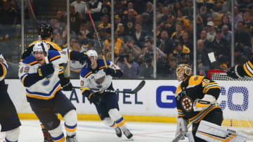 BOSTON, MA - MAY 29: Blues Ivan Barbashev (left) celebrates the Blues Carl Gunnarsson game winning overtime goal as Bruins goalie Tuukka Rask has the puck beneath him. The Boston Bruins host the St. Louis Blues in Game 2 of the 2019 Stanley Cup Finals at TD Garden on May 29, 2019. (Photo by John Tlumacki/The Boston Globe via Getty Images)