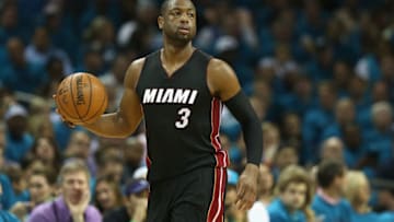 CHARLOTTE, NC - APRIL 29: Dwyane Wade #3 of the Miami Heat brings the ball up the court against the Charlotte Hornets during game six of the Eastern Conference Quarterfinals of the 2016 NBA Playoffs at Time Warner Cable Arena on April 29, 2016 in Charlotte, North Carolina. NOTE TO USER: User expressly acknowledges and agrees that, by downloading and or using this photograph, User is consenting to the terms and conditions of the Getty Images License Agreement. (Photo by Streeter Lecka/Getty Images)