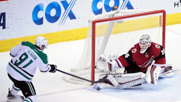 Feb 18, 2016; Glendale, AZ, USA; Arizona Coyotes goalie Louis Domingue (35) makes a save on Dallas Stars center Tyler Seguin (91) in the third period at Gila River Arena. Mandatory Credit: Matt Kartozian-USA TODAY Sports