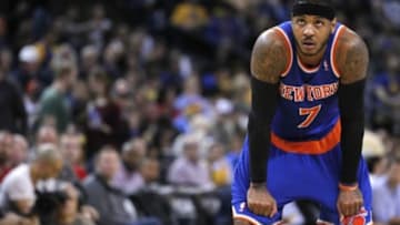 Mar 30, 2014; Oakland, CA, USA; New York Knicks forward Carmelo Anthony (7) rest on the court against the Golden State Warriors in the third quarter at Oracle Arena. The Knicks won 89-84. Mandatory Credit: Cary Edmondson-USA TODAY Sports