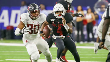 HOUSTON, TX - SEPTEMBER 13: Washington State Cougars defensive lineman Nnamdi Oguayo (30) chases Houston Cougars quarterback D'Eriq King (4) during the AdvoCare Kickoff college football game between the Washington State Cougars and Houston Cougars at NRG Stadium on September 13, 2019 in Houston, Texas. (Photo by Leslie Plaza Johnson/Icon Sportswire via Getty Images)