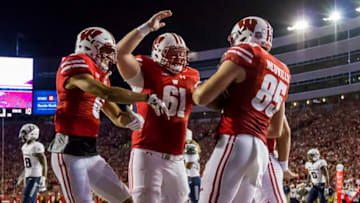 MADISON, WI - SEPTEMBER 01: Wisconsin Badger wide receiver Danny Davis III (6), Wisconsin Badger offensive lineman Tyler Biadasz (61), and Wisconsin Badger tight end Zander Neuville (85) celebrated after scoring a touchdown an college football game between the Utah State Aggies and the Wisconsin Badgers on September 1st, 2017, at Camp Randall Stadium in Madison, WI. Wisconsin defats Utah State 59-10. (Photo by Dan Sanger/Icon Sportswire via Getty Images)