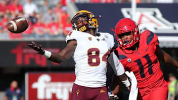 TUCSON, AZ - NOVEMBER 24: Wide receiver Frank Darby #84 of the Arizona State Sun Devils attempts to catch a pass as defensive back Troy Young #11 of the Arizona Wildcats defends during the first half of the college Football game at Arizona Stadium on November 24, 2018 in Tucson, Arizona. (Photo by Ralph Freso/Getty Images)
