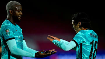 Liverpool, Divock Origi, Takumi Minamino (Photo by PETER POWELL/POOL/AFP via Getty Images)