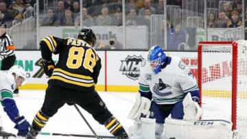 BOSTON, MA - FEBRUARY 04: Vancouver Canucks goalie Jacob Markstrom (25) makes a left pad save on Boston Bruins right wing David Pastrnak (88) during a game between the Boston Bruins and the Vancouver Canucks on February 4, 2020, at TD Garden in Boston, Massachusetts. (Photo by Fred Kfoury III/Icon Sportswire via Getty Images)