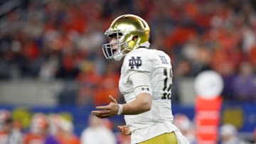ARLINGTON, TEXAS - DECEMBER 29: Ian Book #12 of the Notre Dame Fighting Irish reacts in the second half against the Clemson Tigers during the College Football Playoff Semifinal Goodyear Cotton Bowl Classic at AT&T Stadium on December 29, 2018 in Arlington, Texas. (Photo by Tim Warner/Getty Images)