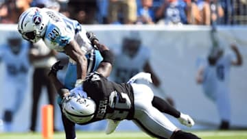 Sep 25, 2016; Nashville, TN, USA; Tennessee Titans running back DeMarco Murray (29) fights off a tackle attempt by Oakland Raiders safety Karl Joseph (42) during the second half at Nissan Stadium. The Raiders won 17-10. Mandatory Credit: Christopher Hanewinckel-USA TODAY Sports
