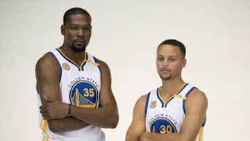 September 26, 2016; Oakland, CA, USA; Golden State Warriors forward Kevin Durant (35) and guard Stephen Curry (30) pose for a photo during media day at the Warriors Practice Facility. Mandatory Credit: Kyle Terada-USA TODAY Sports
