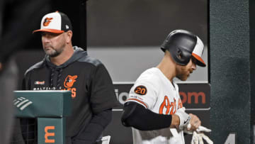 The Baltimore Orioles' Chris Davis, right, walks past manager Brandon Hyde after flying out pinch hitting against the Oakland Athletics in the ninth inning at Oriole Park at Camden Yards in Baltimore on Wednesday, April 10, 2019. The A's won, 10-3. (Kenneth K. Lam/Baltimore Sun/TNS via Getty Images)