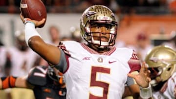 Nov 15, 2014; Miami Gardens, FL, USA; Florida State Seminoles quarterback Jameis Winston (5) passes as the Florida State Seminoles beat the Miami Hurricanes 30-26 at Sun Life Stadium. Mandatory Credit: David Manning-USA TODAY Sports