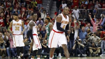 Apr 26, 2016; Atlanta, GA, USA; Atlanta Hawks forward Paul Millsap (4) and guard Dennis Schroder (17) react against the Boston Celtics in the third quarter in game five of the first round of the NBA Playoffs at Philips Arena. The Hawks defeated the Celtics 110-83. Mandatory Credit: Brett Davis-USA TODAY Sports