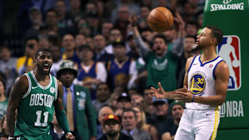 BOSTON - NOVEMBER 16: Boston Celtics' Kyrie Irving, left, and the Warriors' Stephen Curry, right, react after a late fourth quarter play went in Boston's favor. The Boston Celtics host the Golden State Warriors in a regular season NBA basketball game at TD Garden in Boston on Nov. 16, 2017. (Photo by Jim Davis/The Boston Globe via Getty Images)