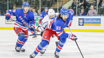 NEW YORK, NY - FEBRUARY 04: New York Rangers center Mika Zibanejad (93) skates with the puck as Los Angeles Kings center Michael Amadio (10) and New York Rangers center Vladislav Namestnikov (90) trail play during the Los Angeles Kings and New York Rangers NHL game on February 4, 2019, at Madison Square Garden in New York, NY. (Photo by John Crouch/Icon Sportswire via Getty Images)