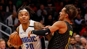 ATLANTA, GEORGIA - FEBRUARY 26: Markelle Fultz #20 of the Orlando Magic is charged with an offensive foul as he drives into Trae Young #11 of the Atlanta Hawks at State Farm Arena on February 26, 2020 in Atlanta, Georgia. NOTE TO USER: User expressly acknowledges and agrees that, by downloading and/or using this photograph, user is consenting to the terms and conditions of the Getty Images License Agreement. (Photo by Kevin C. Cox/Getty Images)