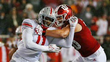 Ohio State Buckeyes defensive end Tyreke Smith (11) moves past Indiana Hoosiers offensive lineman Luke Haggard (70) during the second quarter of a NCAA Division I football game between the Indiana Hoosiers and the Ohio State Buckeyes on Saturday, Oct. 23, 2021 at Memorial Stadium in Bloomington, Ind.Cfb Ohio State Buckeyes At Indiana Hoosiers