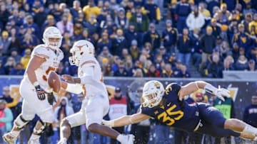 Nov 14, 2015; Morgantown, WV, USA; West Virginia Mountaineers linebacker Nick Kwiatkoski dives for Texas Longhorns quarterback Jerrod Heard during the third quarter at Milan Puskar Stadium. Mandatory Credit: Ben Queen-USA TODAY Sports