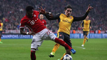 MUNICH, BAVARIA - FEBRUARY 15: Hector Bellerin of Arsenl competes with David Alaba of Bayern Munich during the UEFA Champions League Round of 16 first leg match between FC Bayern Muenchen and Arsenal FC at Allianz Arena on February 15, 2017 in Munich, Germany. (Photo by Chris Brunskill Ltd/Getty Images)