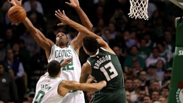 BOSTON - OCTOBER 18: Boston Celtics center Al Horford (42) and Boston Celtics forward Jayson Tatum (0) double down defensively on Milwaukee Bucks guard Malcolm Brogdon (13) during the first quarter. The Boston Celtics host the Milwaukee Bucks in the team's home season opener at TD Garden in Boston on Oct. 18, 2017. (Photo by Barry Chin/The Boston Globe via Getty Images)