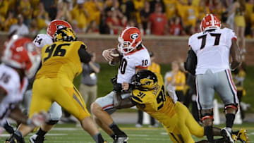 Sep 17, 2016; Columbia, MO, USA; Georgia Bulldogs quarterback Jacob Eason (10) is sacked by Missouri Tigers defensive end Charles Harris (91) in the first half at Faurot Field. Mandatory Credit: John Rieger-USA TODAY Sports