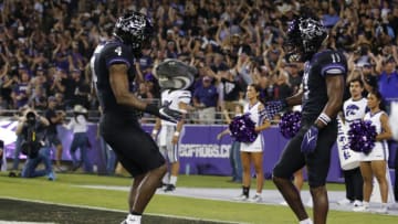 Oct 22, 2022; Fort Worth, Texas, USA; TCU Horned Frogs wide receiver Derius Davis (11) and TCU Horned Frogs wide receiver Taye Barber (4) celebrate a touchdown in the first half against the Kansas State Wildcats at Amon G. Carter Stadium. Mandatory Credit: Tim Heitman-USA TODAY Sports