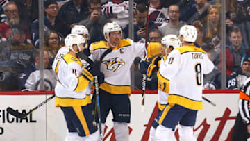 WINNIPEG, MB - FEBRUARY 27: Ryan Ellis #4, Craig Smith #15, Roman Josi #59, Kevin Fiala #22 and Kyle Turris #8 of the Nashville Predators celebrate a second period goal against the Winnipeg Jets at the Bell MTS Place on February 27, 2018 in Winnipeg, Manitoba, Canada. (Photo by Jonathan Kozub/NHLI via Getty Images)