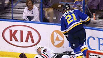 Nov 9, 2016; St. Louis, MO, USA; Chicago Blackhawks center Dennis Rasmussen (70) hits the ice after being checked by St. Louis Blues center Patrik Berglund (21) during the third period at Scottrade Center. The Blackhawks won 2-1. Mandatory Credit: Billy Hurst-USA TODAY Sports